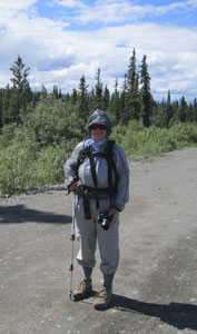 Okay, my pointed stick is a hiking pole... and I don't have a bag, but it's a funny photo of the gitty-up we wore to hike among the mosquitoes a few years ago in Alaska.
